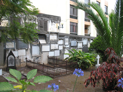 Wall of tombstones inside the British Cemetery, Funchal, Madeira