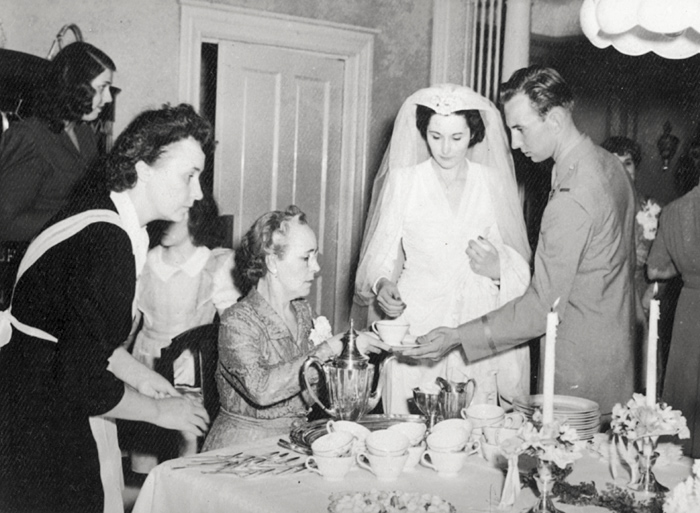 Ethel Maude Miller Boyd pouring tea at the wedding reception of her sister Lucy Healy's daughter, Hope Healy, to Cletus Joseph Gombold, 16 May 1944.